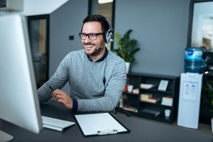 portrait-handsome-smiling-man-with-headset-working-computer-300x200 Social Media